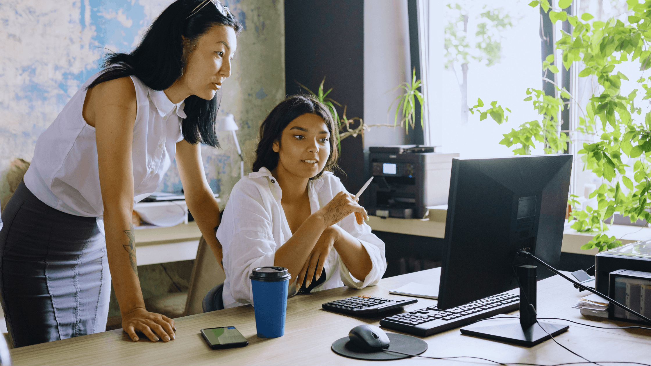 Two women discussing what to do with money.